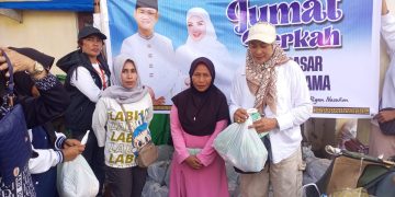 Pasangan MDR-Bella Bantu Pedagang dan Dhuafa Lewat Aksi Sosial di Namlea